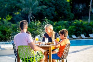 Guests enjoying lunch, poolside at Holiday Inn Resort Vanuatu